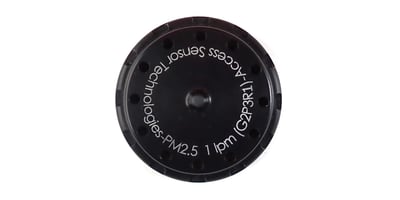 Photograph of a PM2.5 1 LPM inlet for particulate matter samplers sold by Access Sensor Technologies. This inlet consists of a round aluminum cap that is approximately 2 inches in diameter and anodized black.