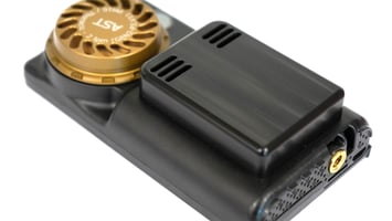 A photograph of a UPAS v2.1 PLUS with a PM10 inlet installed. The focus of the image is the end of the UPAS housing where the microSD card is installed.