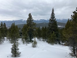 A photograph of a snowy mountain landscape in Colorado